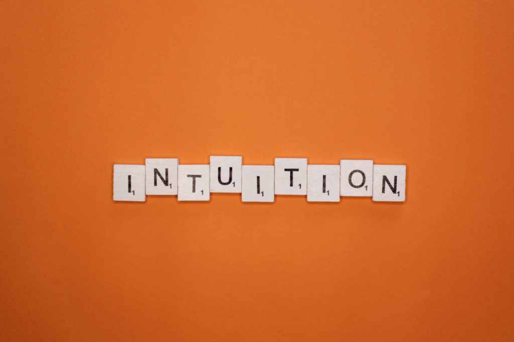 Intuition scrabble letters word on a orange background