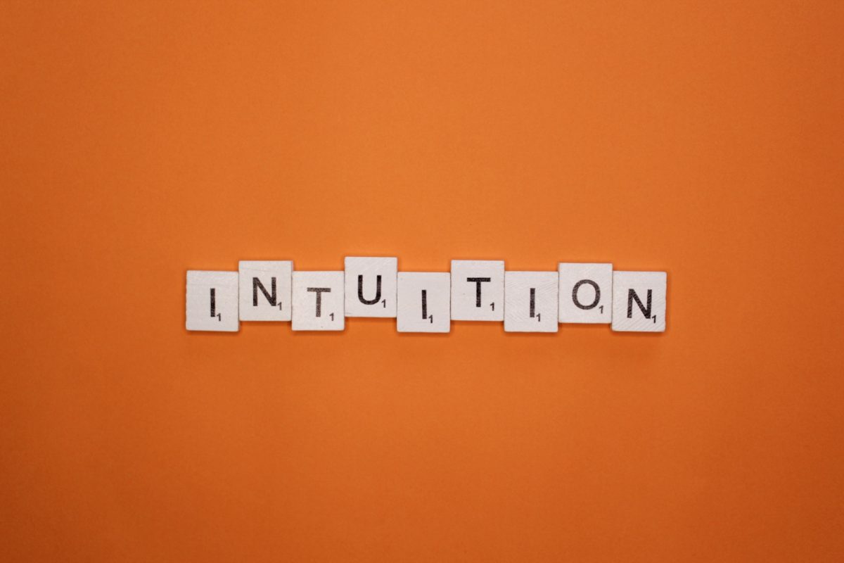 Intuition scrabble letters word on a orange background
